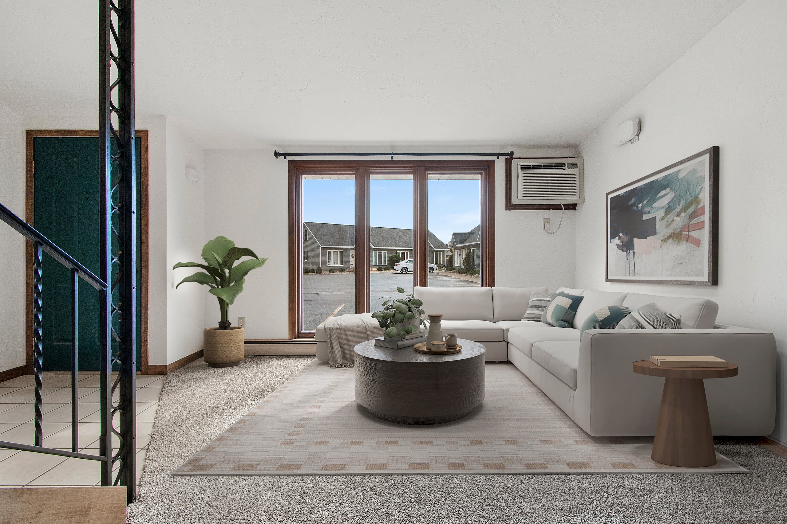 Virtually staged living room in a representative Loft Apartments home